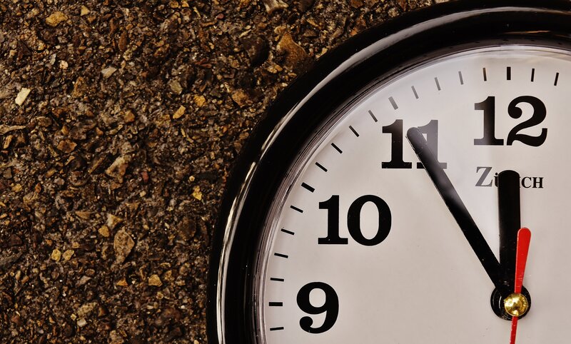 clock on gravel surface