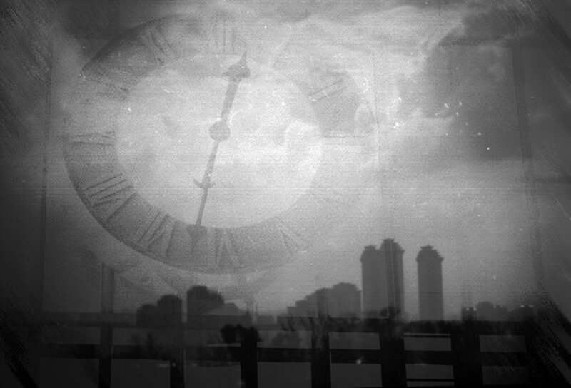 Clock over City Skyline
