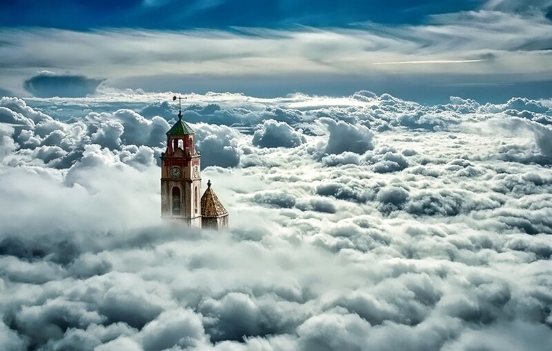 Clock Tower Above Clouds