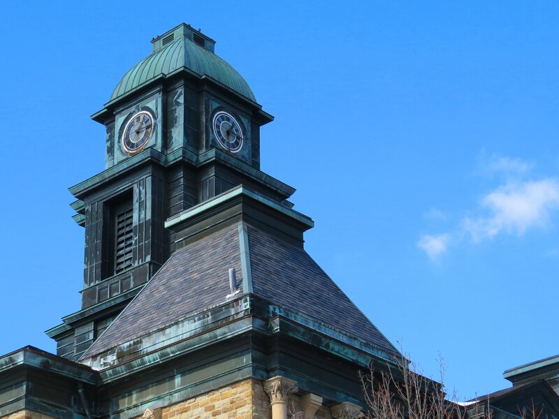Clock Tower Against Blue Sky — Serene