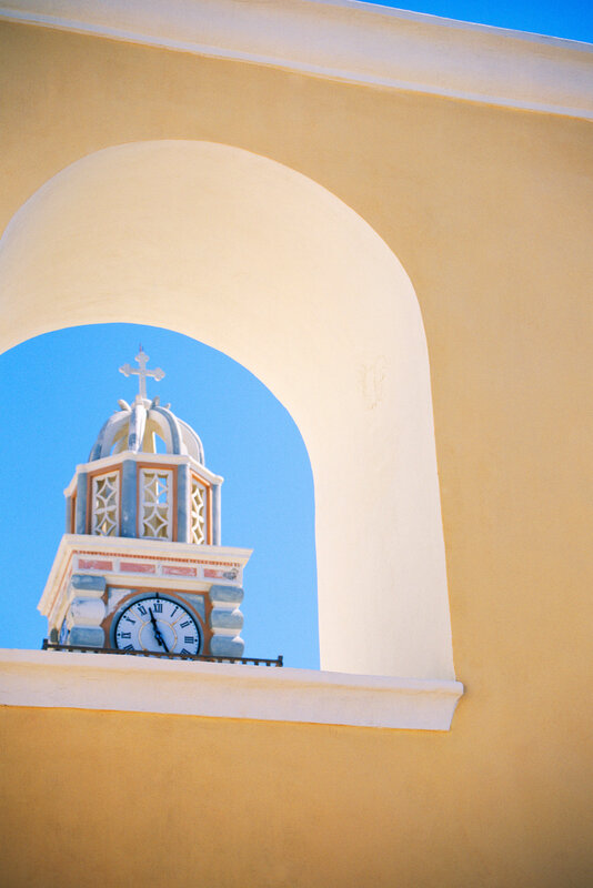 Clock tower through archway