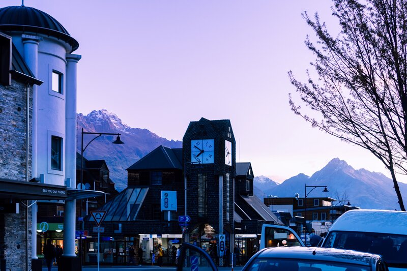 Clock Tower with Mountains