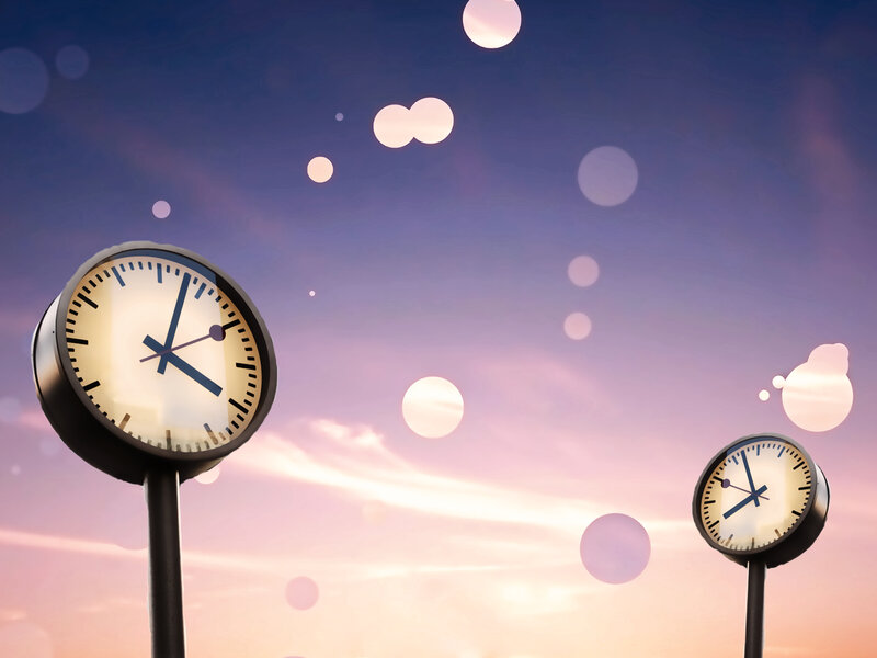 Clocks against a twilight sky