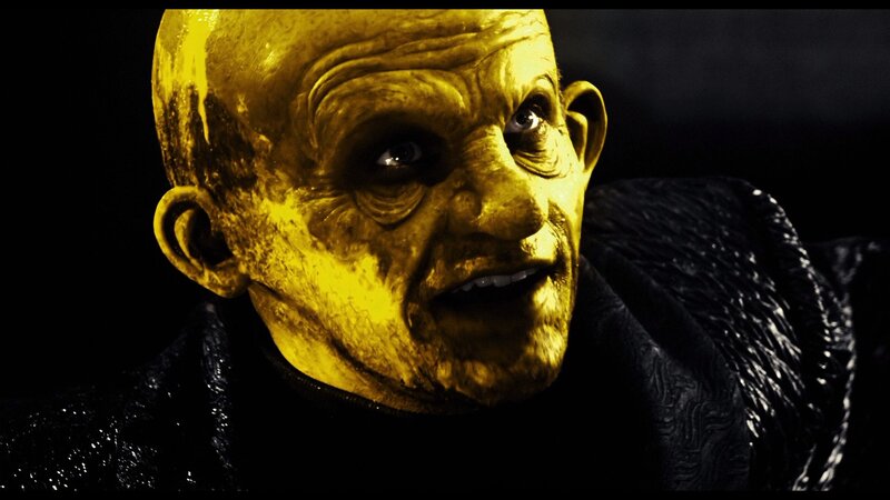 close-up of a bald man with yellow face