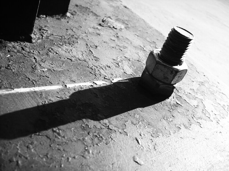 close-up of a bolt on concrete