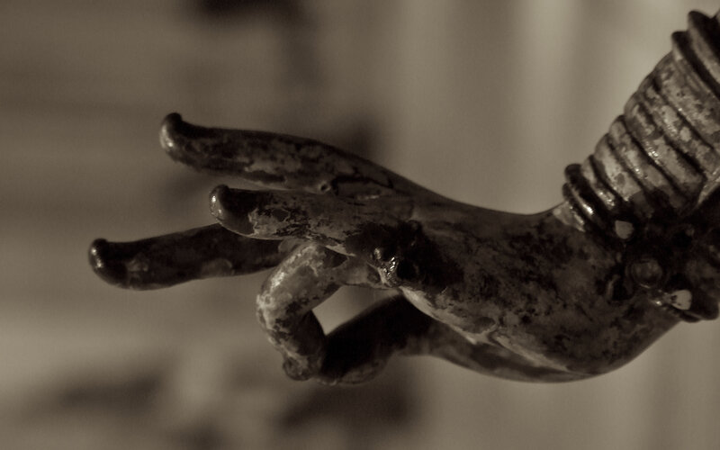 close-up of a bronze hand