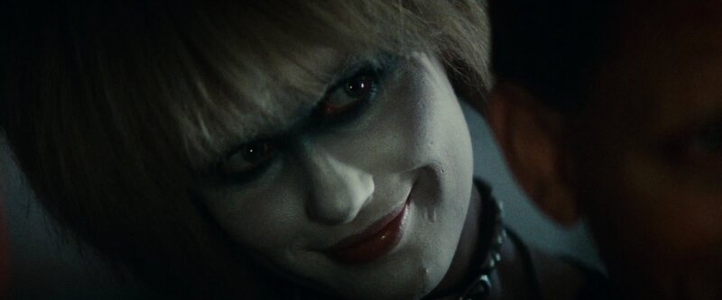 close-up of a character with pale makeup
