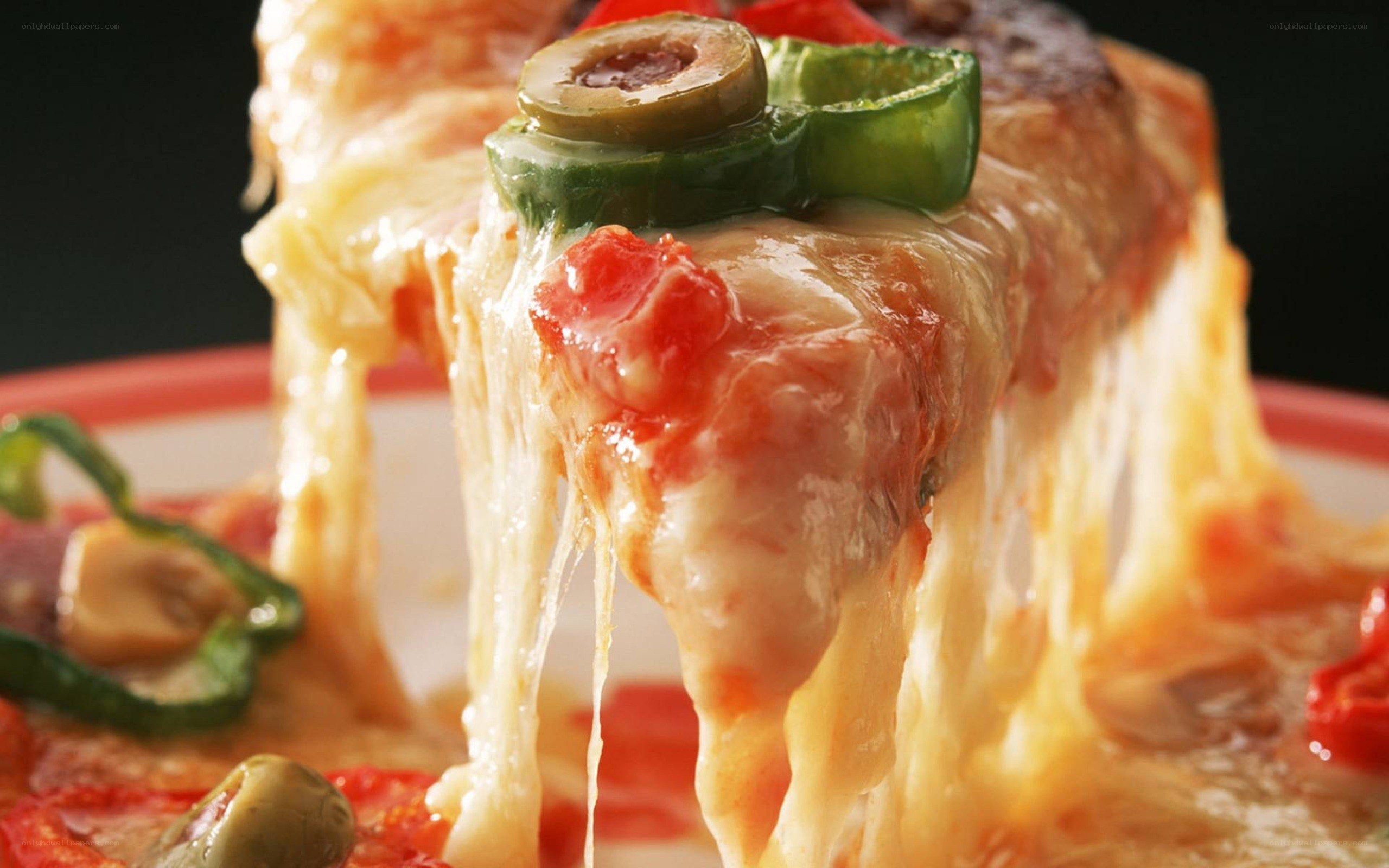 Close-up of a cheesy pizza slice