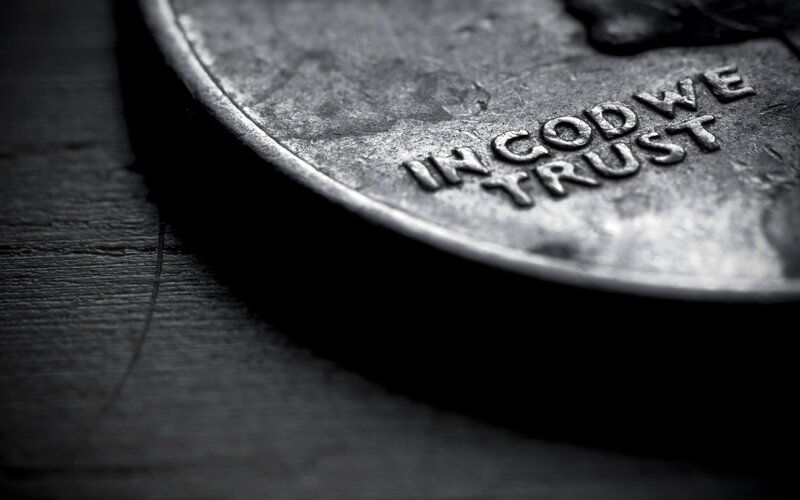 Close-up of a coin with 'In God We Trust'