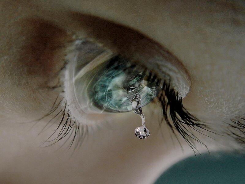 Close-up of a Crying Eye — White, Dramatic, Photograph