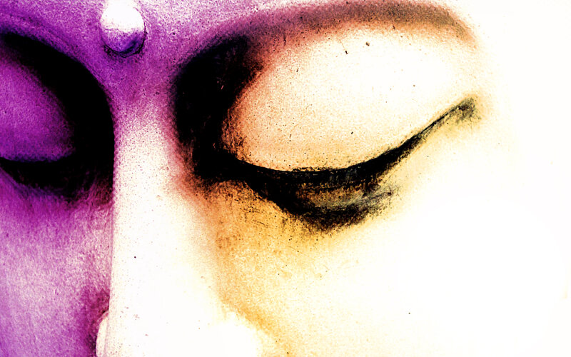 close-up of a face with purple and gold tones