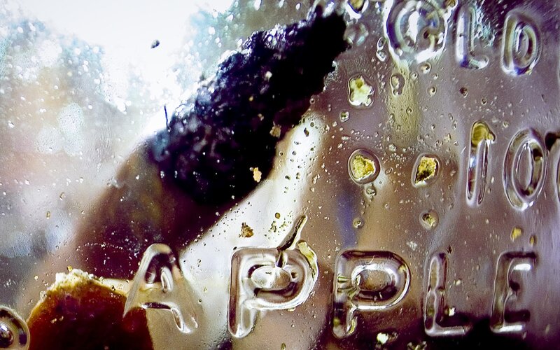 Close-up of a glass bottle with embossed text