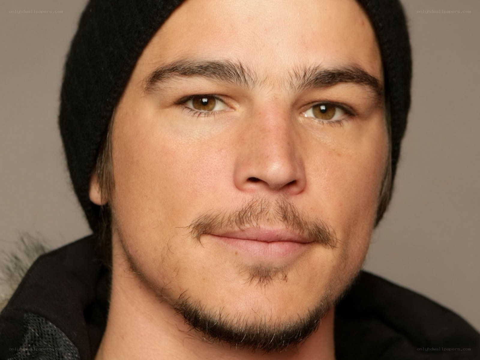 close-up of a man wearing a beanie
