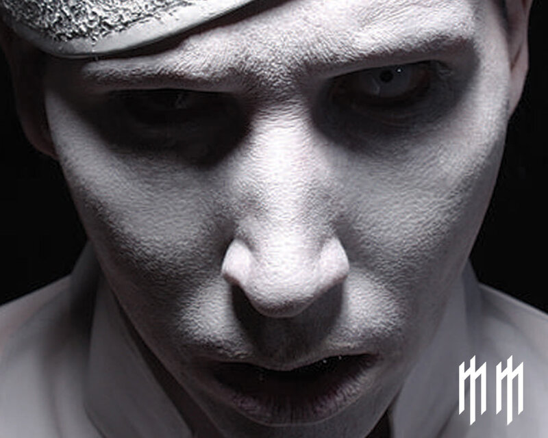 close-up of a person in white makeup