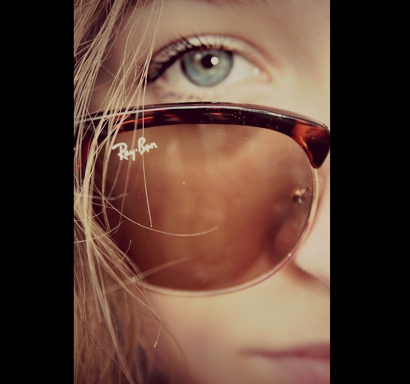 close-up of a person's eye with sunglasses
