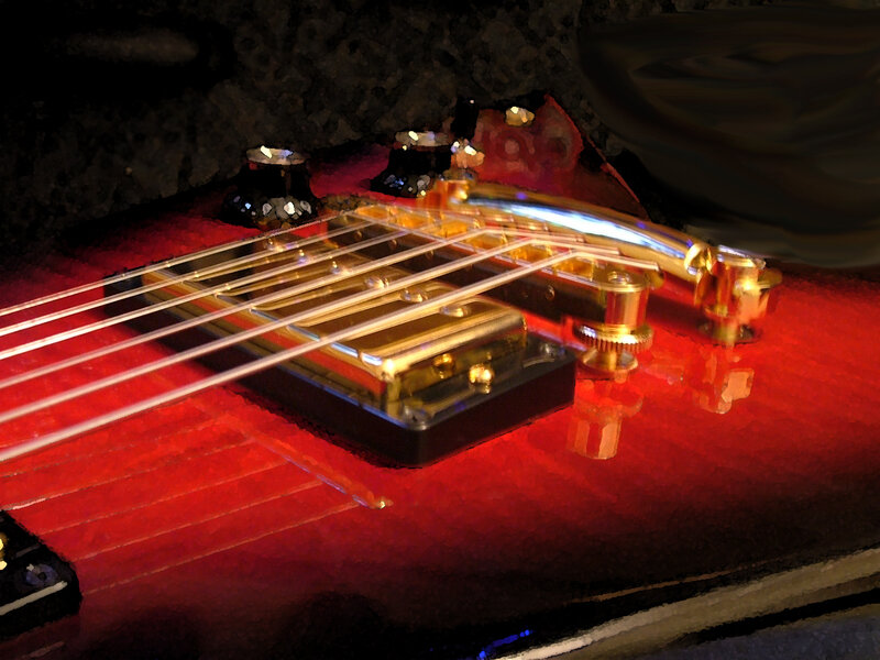 Close-up of a red electric guitar