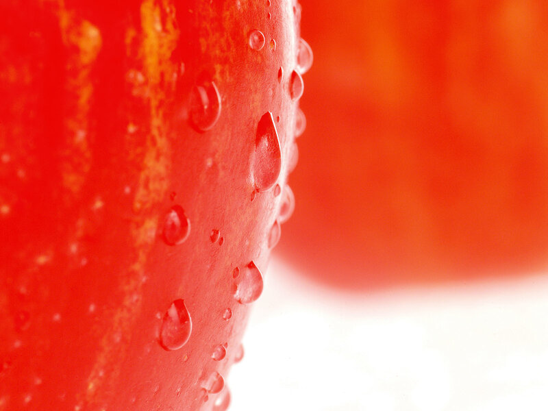 Close-up of a red fruit with water droplets