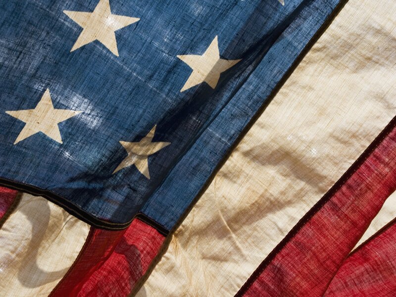 Close-up of a weathered American flag