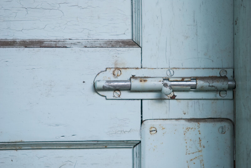 close-up of a weathered door latch