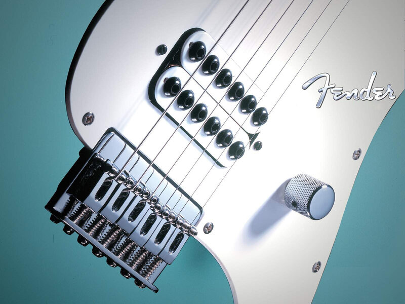 close-up of a white electric guitar