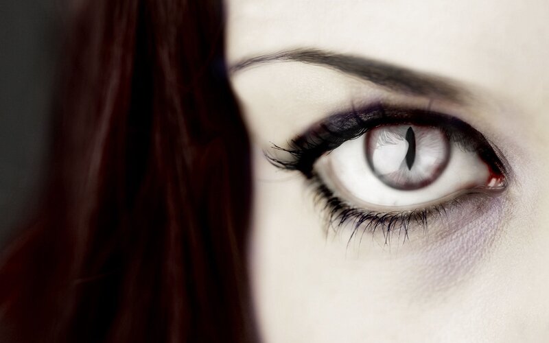 close-up of a white-eyed figure