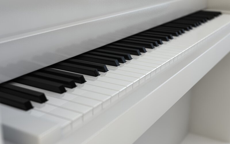 Close-up of a white piano keyboard