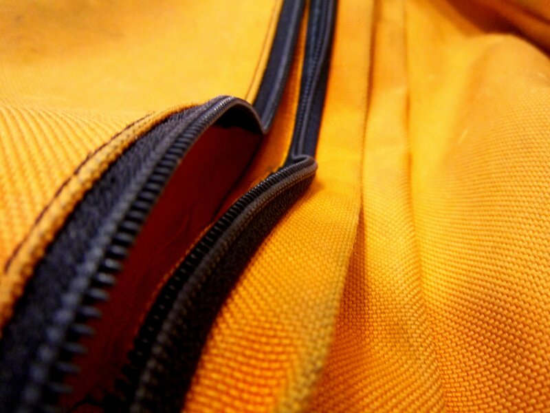 close-up of a yellow bag zipper