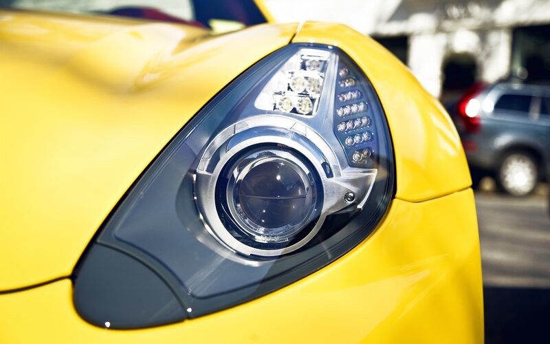 Close-up of a yellow car headlight