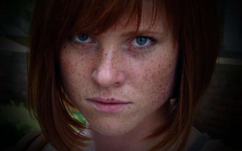 close-up of a young woman with freckles