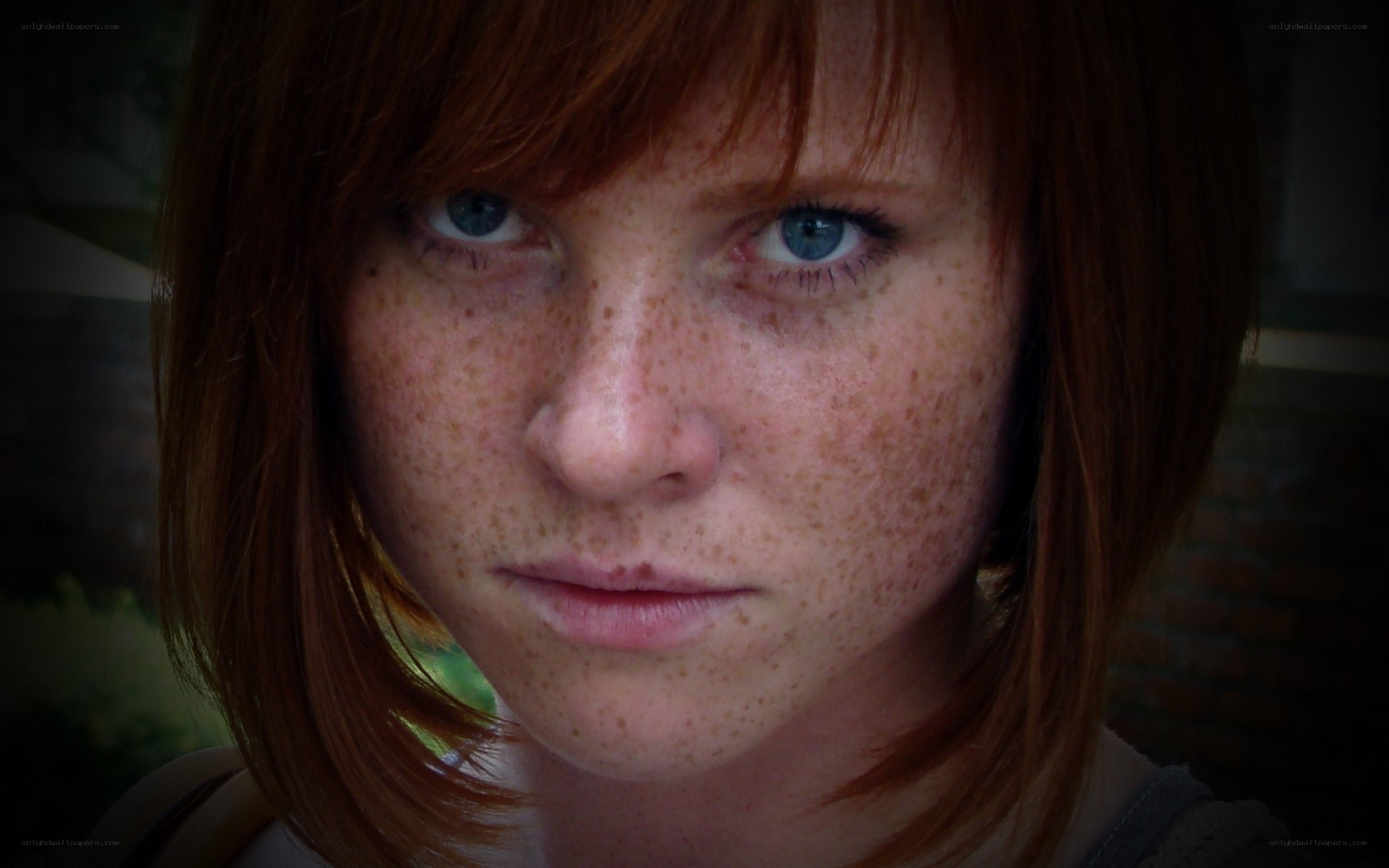 close-up of a young woman with freckles