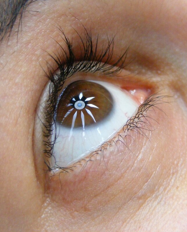 close-up of an eye with a star pattern