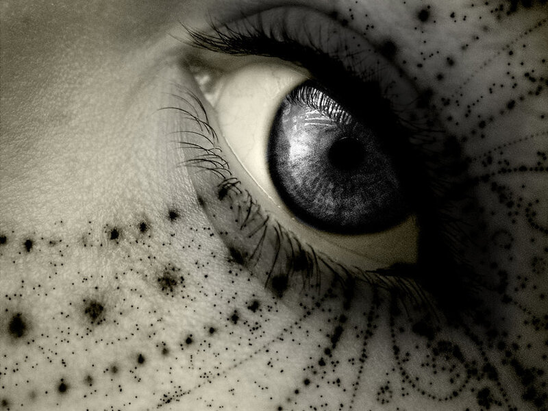 close-up of an eye with dots