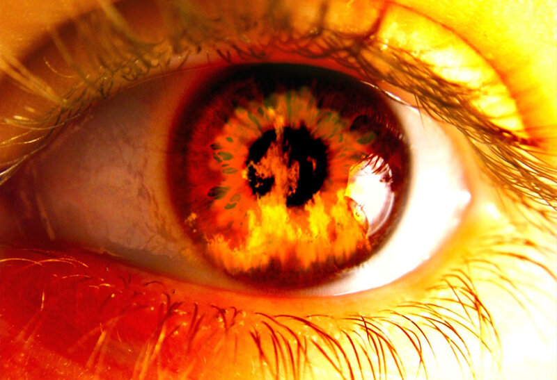 close-up of an eye with fire effect