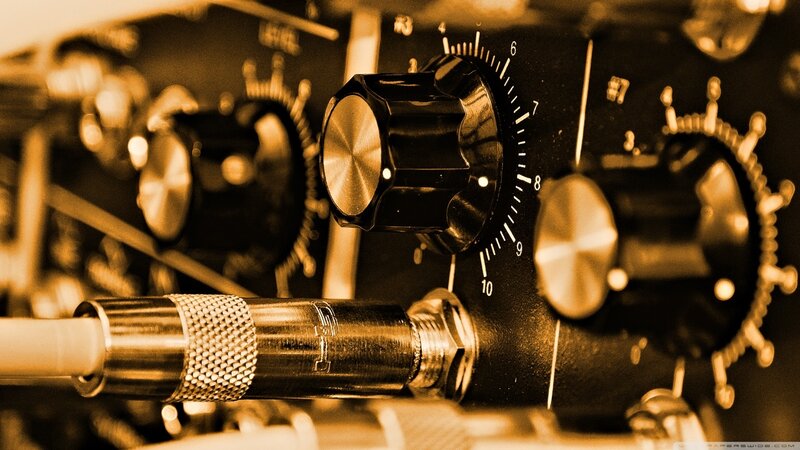 Close-up of audio equipment knobs