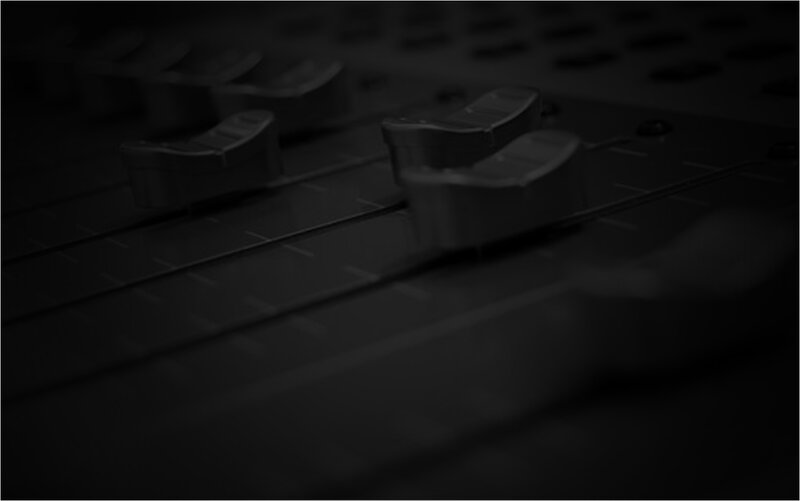 close-up of audio faders