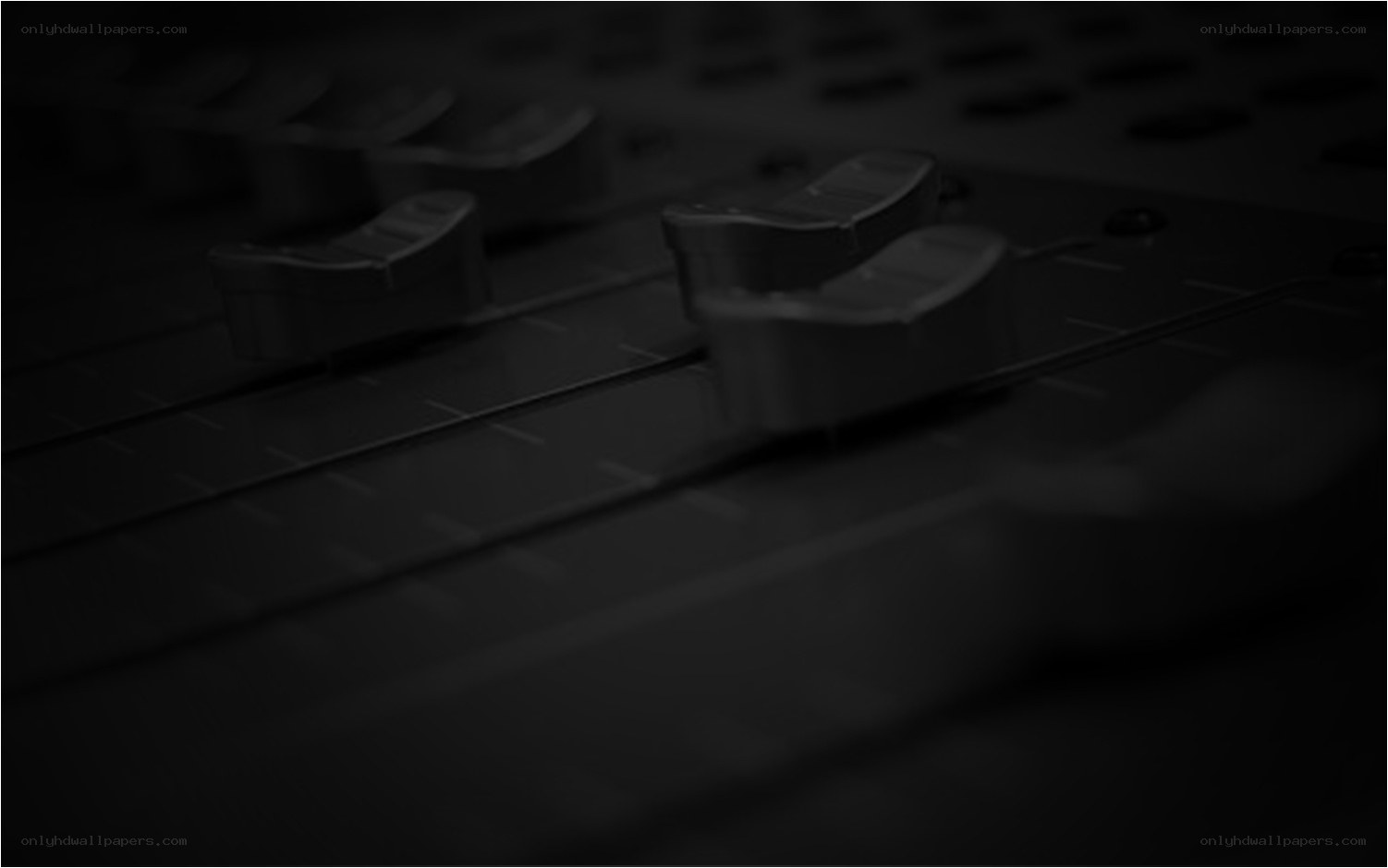 close-up of audio faders