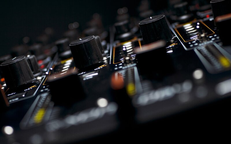 close-up of audio mixer controls