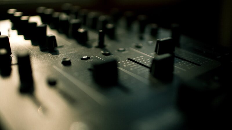 close-up of audio mixer controls