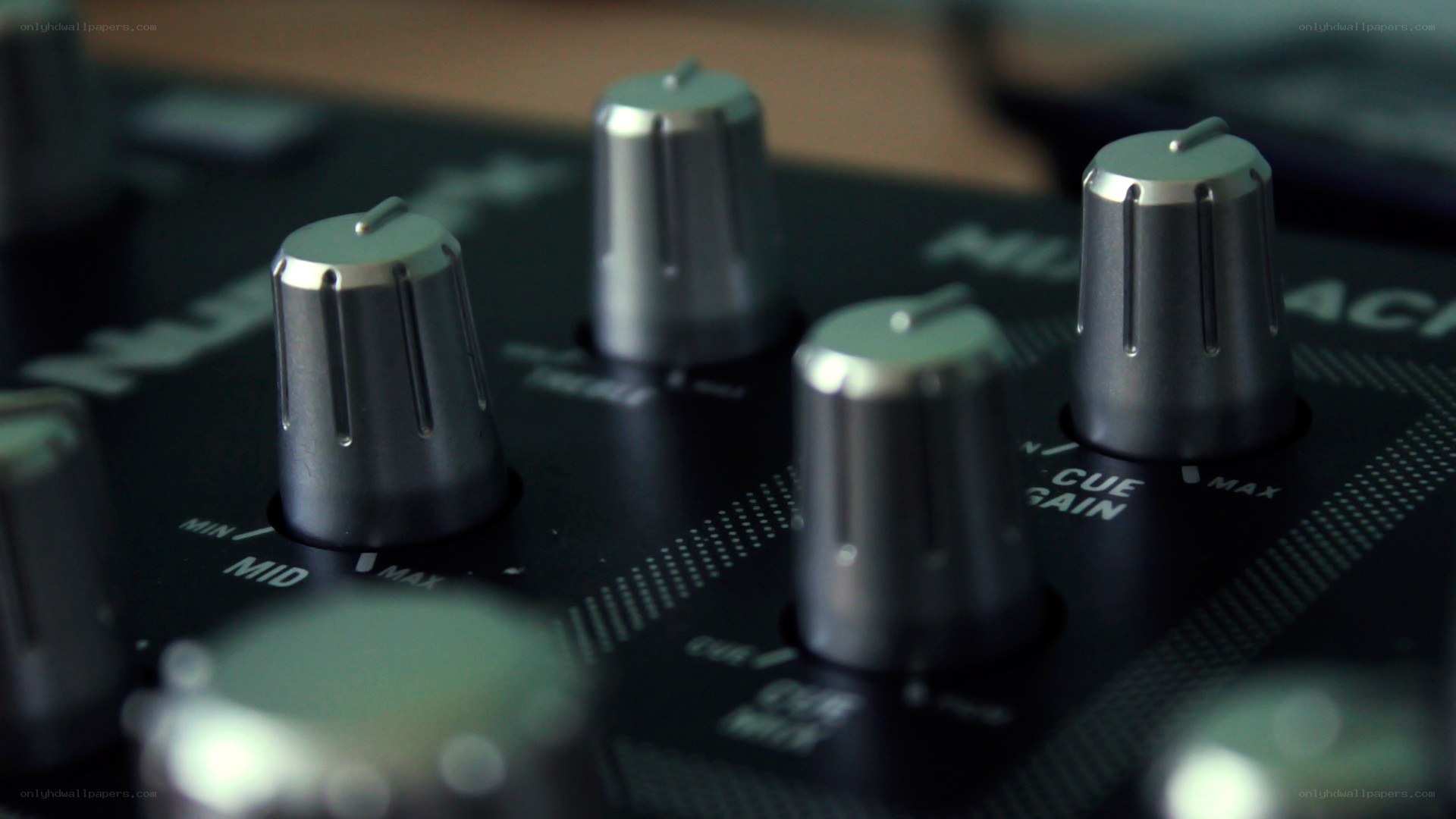 close-up of audio mixer knobs
