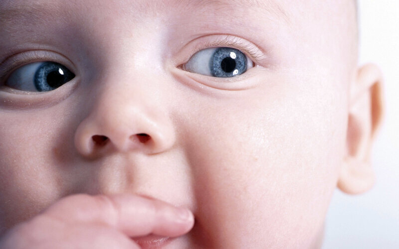 Close-up of Baby's Face — White