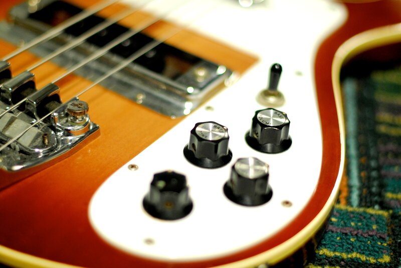 close-up of bass guitar controls