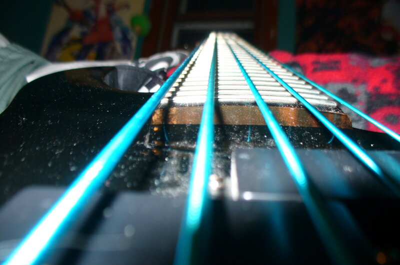 close-up of bass guitar strings
