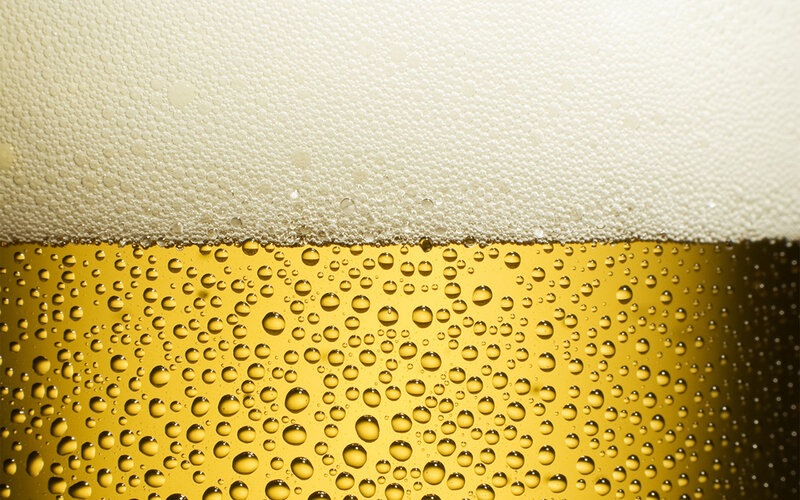 close-up of beer foam and bubbles