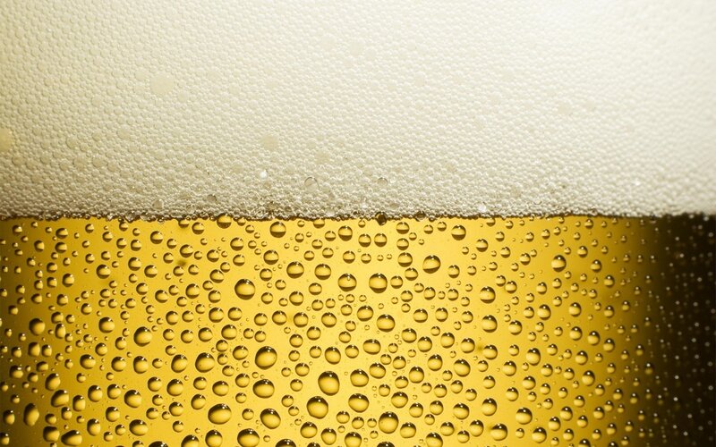 close-up of beer foam and bubbles