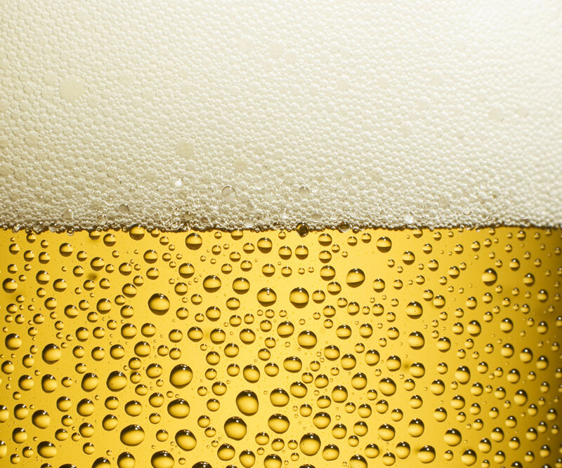 Close-up of beer foam and bubbles
