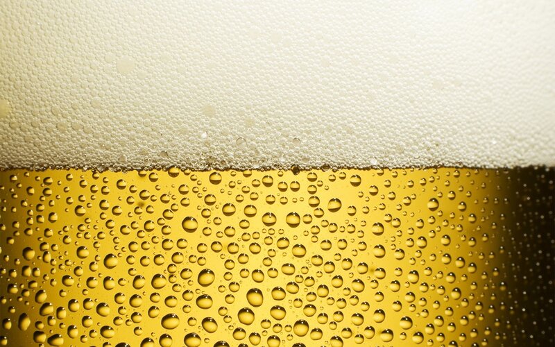 Close-up of beer foam and bubbles