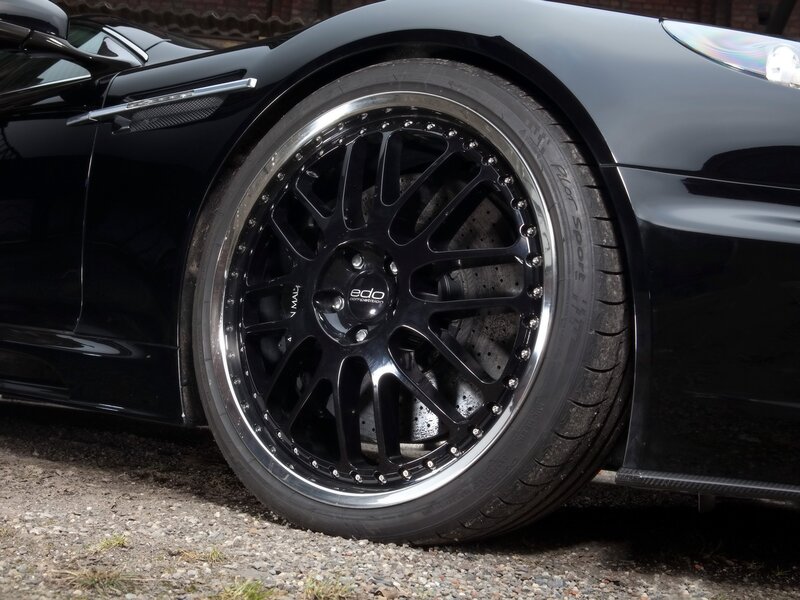 close-up of black sports car wheel
