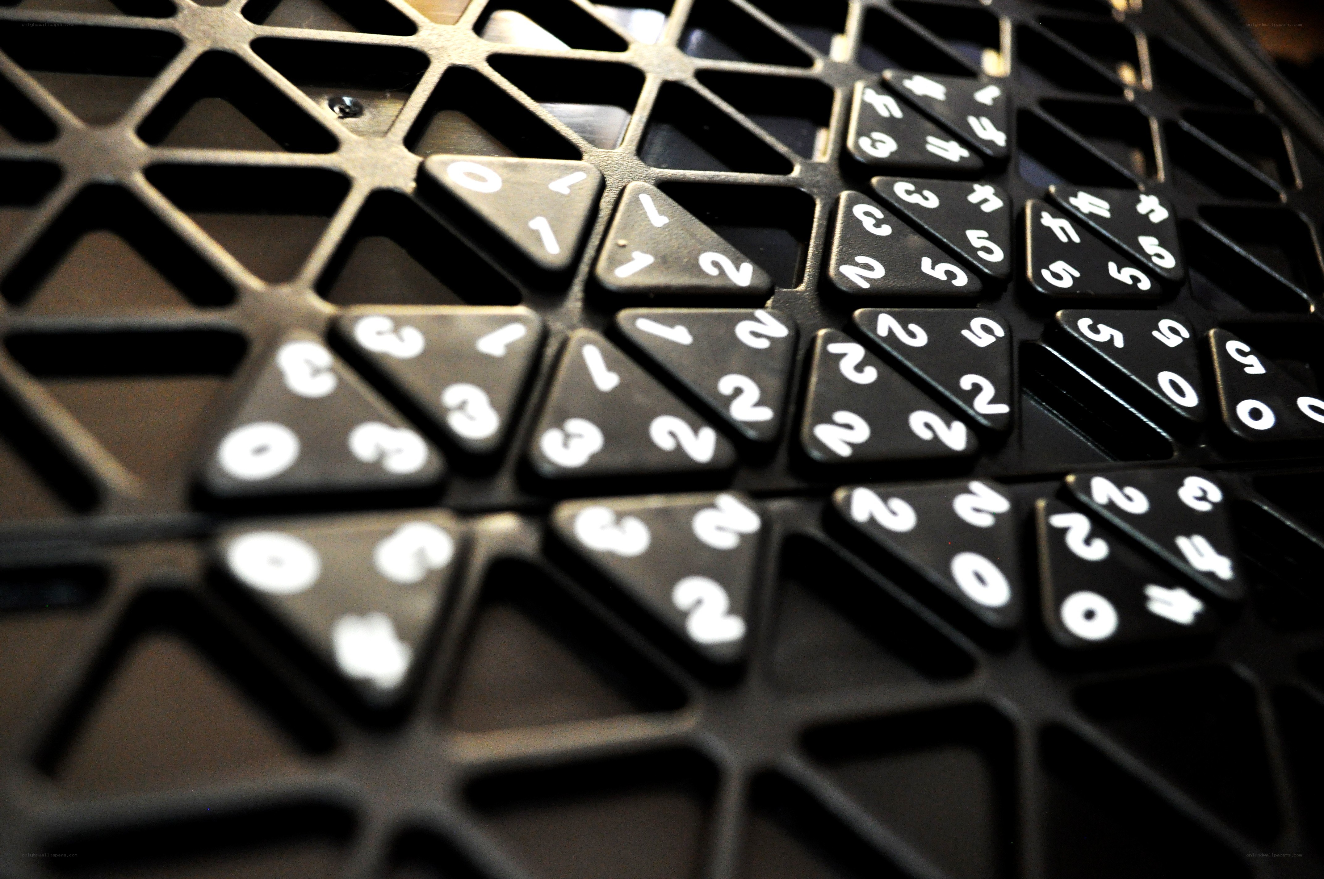 close-up of black triangular tiles