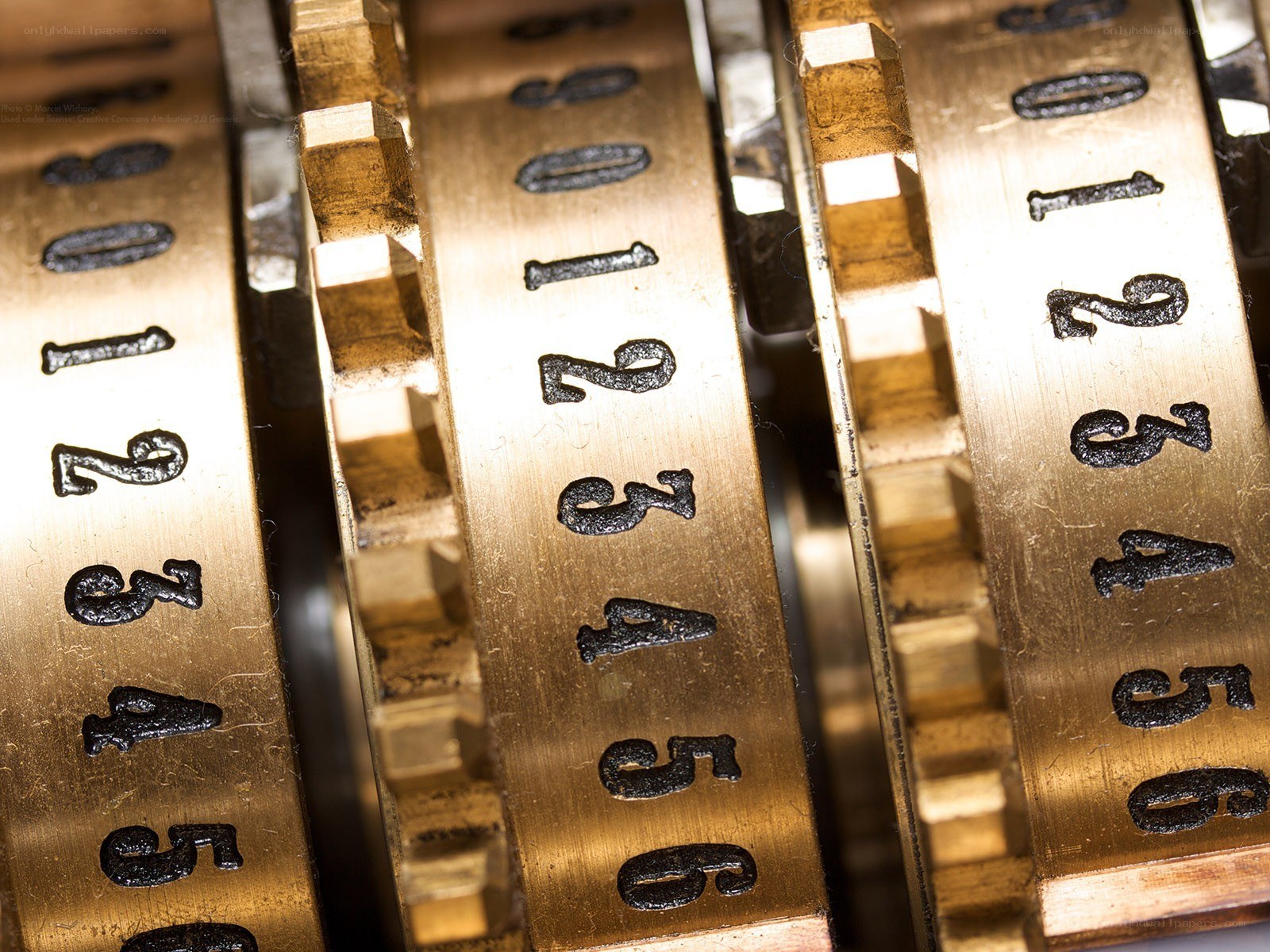 Close-up of brass cipher wheels