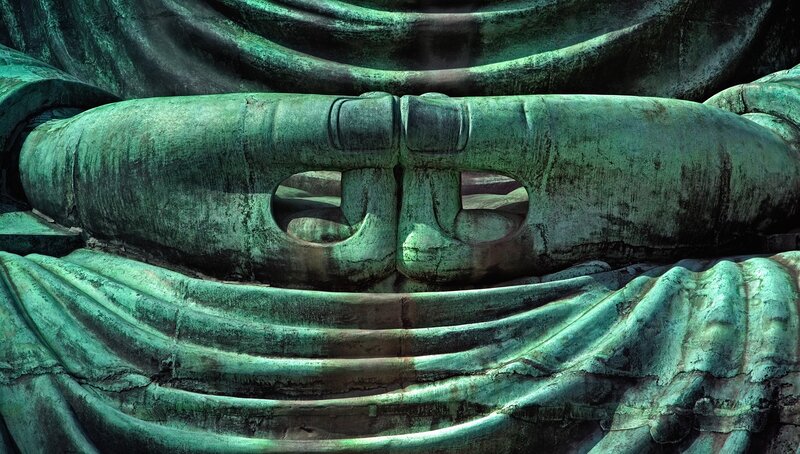 close-up of bronze buddha statue